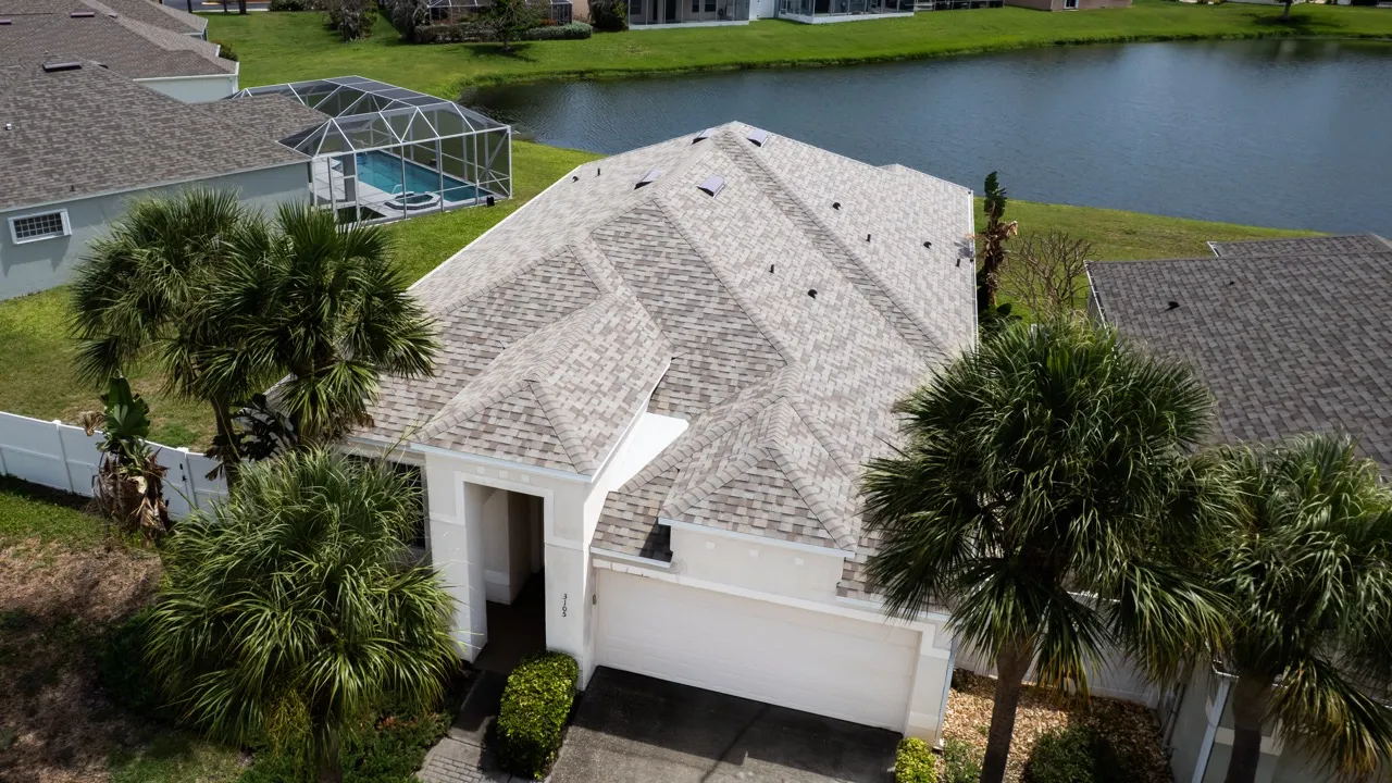 Aerial view of a Gulf Coast home with a newly installed shingle roof