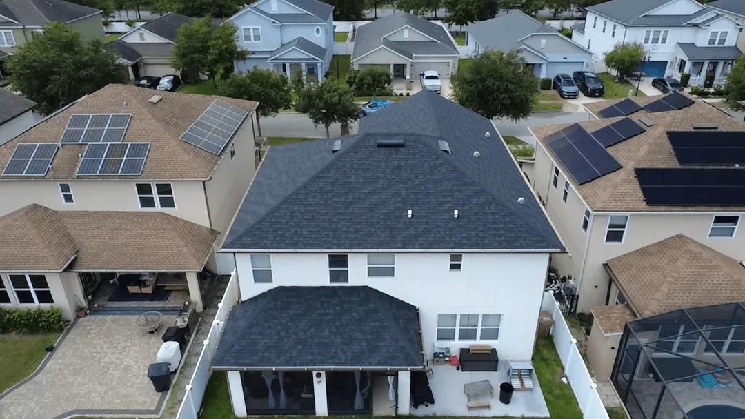 Overhead drone shot of a full roof replacement in a Florida subdivision